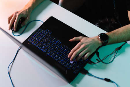 Hands man using laptop on white table. Writing, typing. Freelance concept. Work home. Marketing,...
