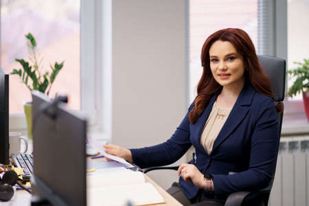 Caucasian woman working laptop. Business woman busy working on laptop computer at office.