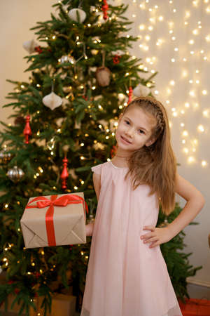Thank you. Celebrate Xmas. Kid birthday gift. Extra bonus. Grateful for good gift. Surprise and present box. Child smiling happy hold gift box. Kid girl delighted gift. Expected surpriseの写真素材