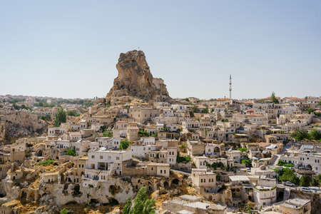 Day view of Goreme town with blue clear sky on horison. Famous center of balloon fligthsの写真素材