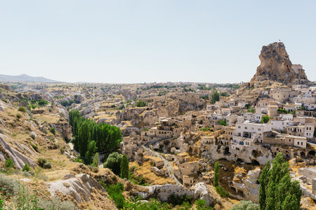 Day view of Goreme town with blue clear sky on horison. Famous center of balloon fligthsの写真素材