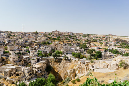 Day view of Goreme town with blue clear sky on horison. Famous center of balloon fligthsの写真素材