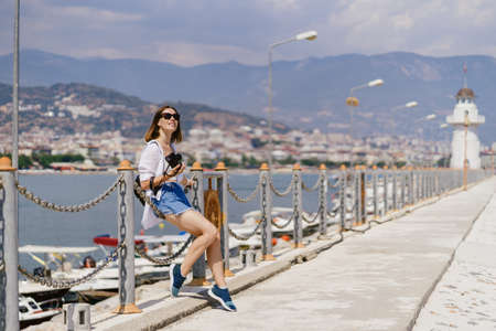 Turkey travel tourist woman on vacation in the Alanya sitting on embankment. Turkey summer destination.の写真素材