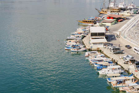Alanya, Turkey - 24 July 2021: Sea pier port for yachts and boats in marina on a background of...
