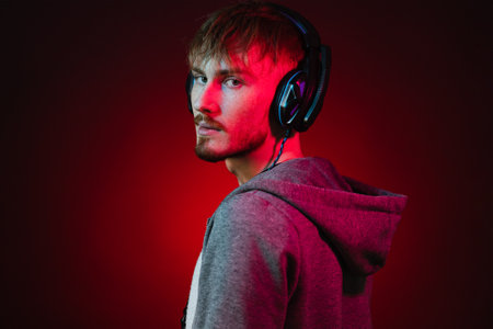 Neon portrait of a bearded man in headphones, wearing parka