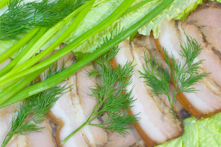 Smoked pork gammon, on salad sheet with fennel and onion.の写真素材