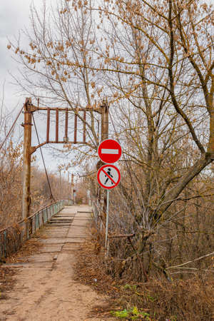Road signs prohibiting passage and passage. Road signs in front of the destroyed bridge, "passage is prohibited", "passage is prohibited".の写真素材