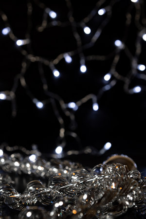 Silver Christmas decorations, garlands and balloons. Christmas decorations and garlands create a...