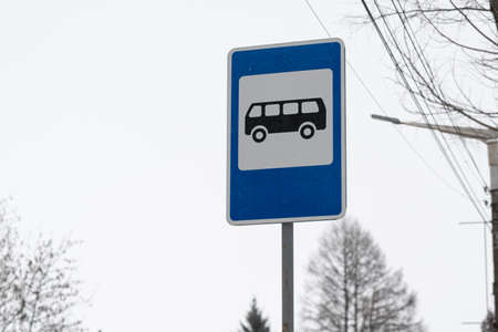 A road sign indicating a bus stop. Bus stop sign against the sky.の写真素材