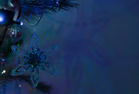 christmas decoration on the christmas tree, blue background with copy spaceの写真素材