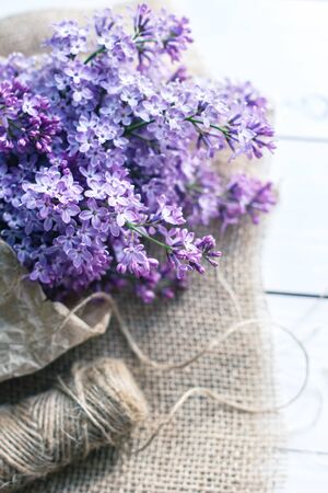 lilac flowers on white old wooden backgroundの写真素材