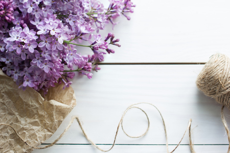 lilac flowers on white old wooden background.の写真素材