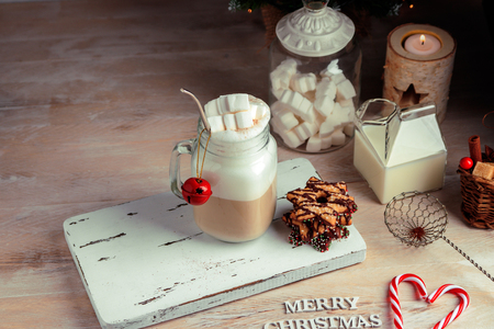 Mug with hot chocolate drink and marshmallows on the top. Christmas colorful still life. Cozy festive moodの写真素材