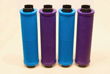 Colored bicycle grips close-up on a light background