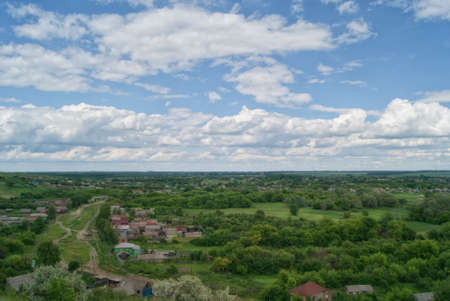 View from the hills to the village and the winding roads of the street.の写真素材
