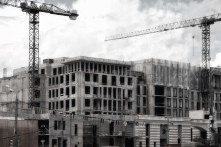Construction of multi-storey panel houses, Skyscraper in the metropolis with high cranes. Building Moscow.の写真素材