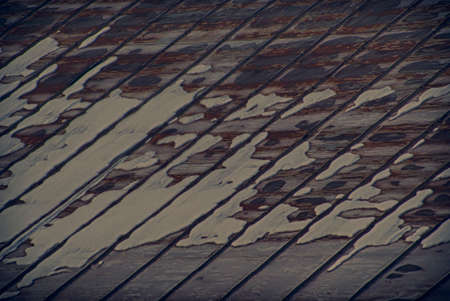 The texture of the old snow-covered roof.の写真素材