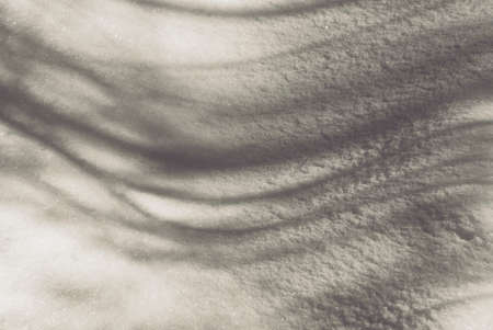 The texture of the February snow and snowdrifts close-up.の写真素材