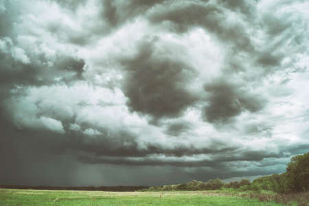 Large picturesque rain clouds over fields and meadows of Russia.の写真素材