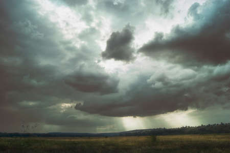 A cloudy day in a green valleyの写真素材