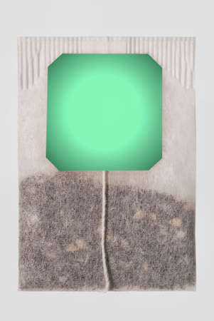 Teabag of close-up on a white isolated background and ready free space copyspace on the labelの写真素材