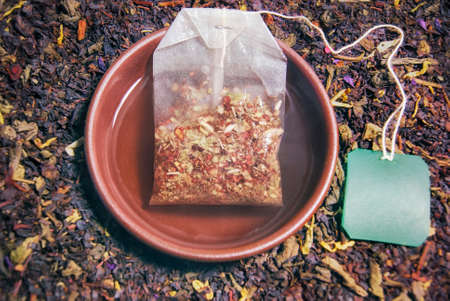 Herbal tea in a cup of brewed tea bag closeup composition and ready free space copyspace on the labelの写真素材