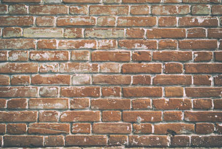 Texture of brick wall with cracked weathered structure red white color close-up .の写真素材