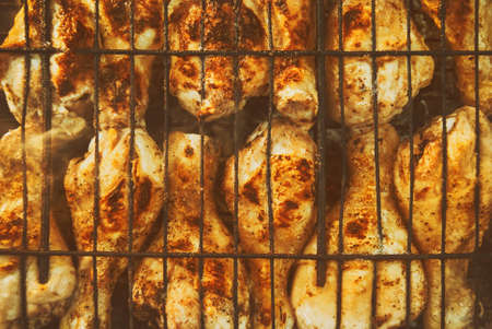 Fried roasted grilled chicken legs . BBQ Grill background.の写真素材