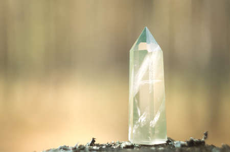 Large clear pure transparent great royal crystal of green quartz chalcedony diamond on nature blurred bokeh background close upの写真素材