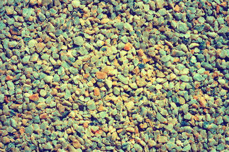 Texture of small colored gravel stone for use as a designer backgroundの写真素材