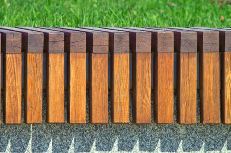 Repeating texture of wooden bars. Modern architecture bench in the city parkの写真素材