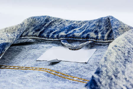 Close-up photo of several elements of a beautiful and fashionable denim jacket.