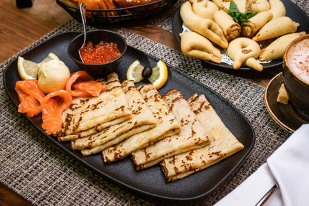 Pancakes for breakfast with salmon and red caviarの写真素材