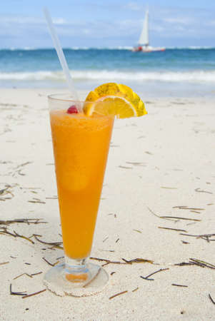 The cocktail with rum and juice on the caribbean beachの写真素材