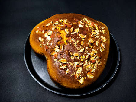 Home baked cake with roasted almonds sprinkled on itの写真素材