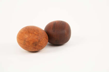 Two wooden eggs isolated on white backgroundの写真素材