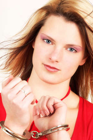 Young woman in game with police handcuffsの写真素材