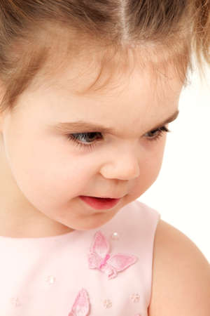 Closeup portrait of a small girl in pink dress