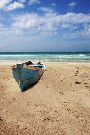 Old boat on beach of Punta Cana, Dominican Republicの写真素材