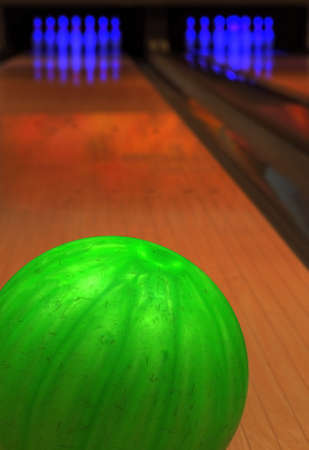Bowling ball with pins in backgoundの写真素材