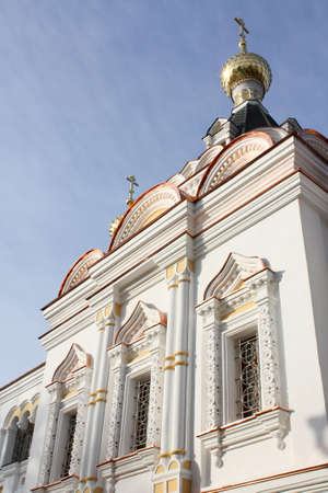 Facade of Orthodox church with beautiful windows on a background of sky
