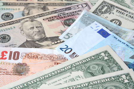 Money. World currencies: U.S. dollars, pounds and euros. Banknotes.