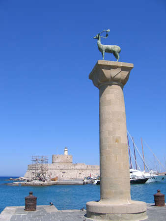 Column statue of a deer at the Mandraki harbor of Rhodes townの写真素材
