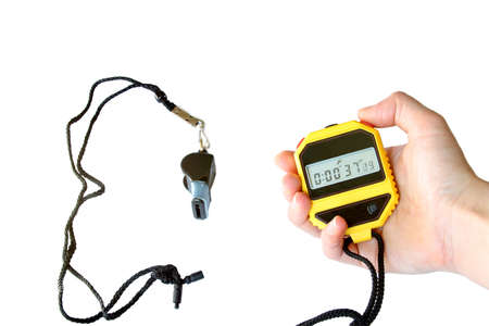 stopwatch in the hand and  sports whistle. Isolated on whiteの写真素材