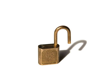 unlocked padlock and it's shadow. isolated on whiteの写真素材
