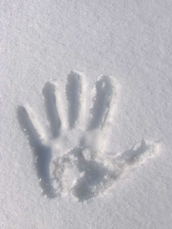 Hand Print in Snowの写真素材