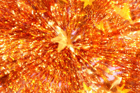 Christmas background of tinsel with stars