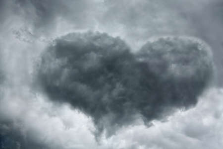 Heart shaped cloud on stormy sky 