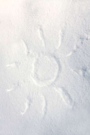Sun drawn on the fresh snowの写真素材