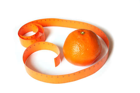 Orange and measuring tape. Isolated on whiteの写真素材